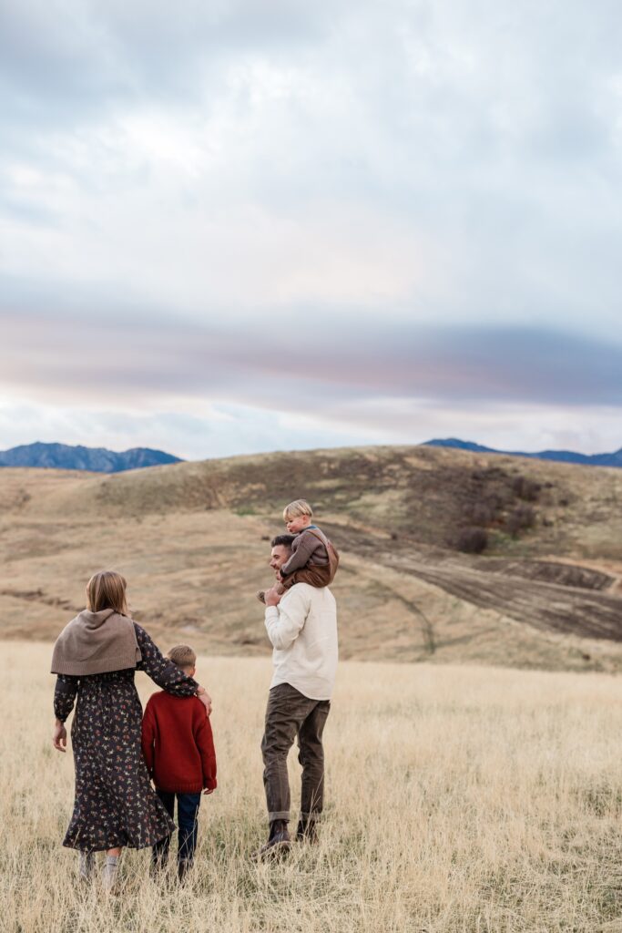 Family walking during a beautiful November family photo session in Cache Valley Utah