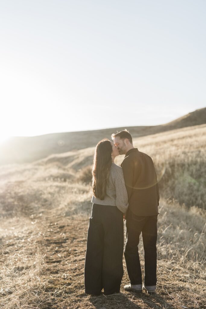 Couple kissing in engagement photos in Logan Utah