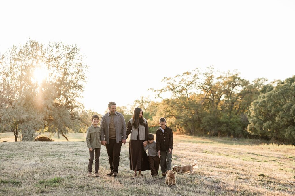 Family photos in Layton Utah, family of boys walking through field.
