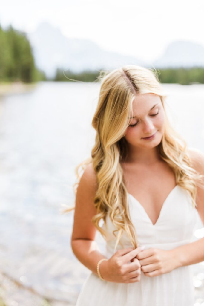 beautiful photo of girl at Jackson Lake in the Tetons for her senior photos